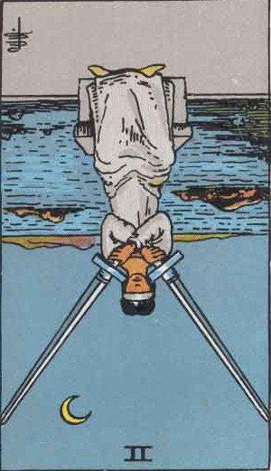 The Reversed Two Of Swords Tarot Card From The Rider-Waite Tarot Deck.