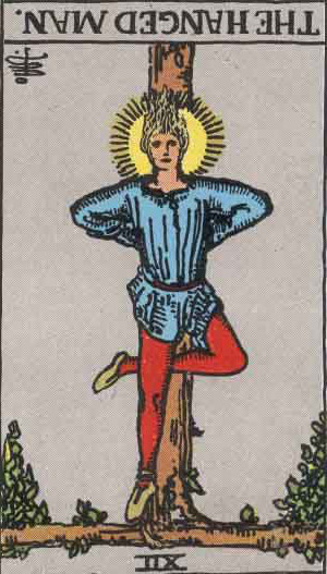 The Reversed Hanged Man Tarot Card From The Rider-Waite Tarot Deck.